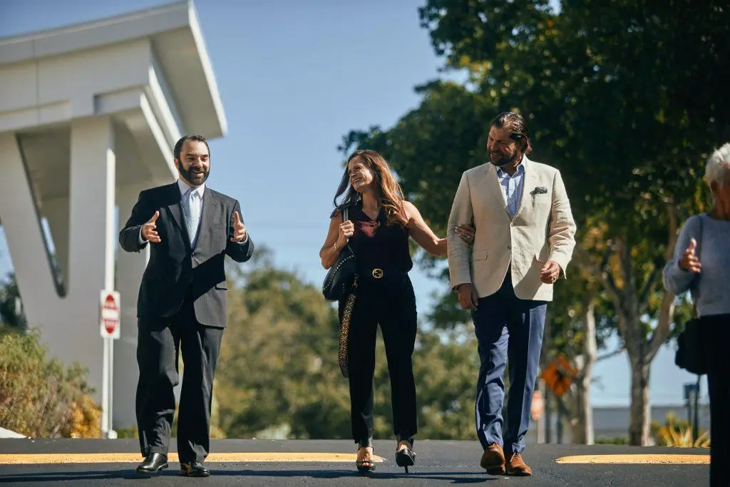 Couple walking with Rabbi Greg Weisman from Temple Beth El Schaefer Family Campus to the Beth El Mausoleum