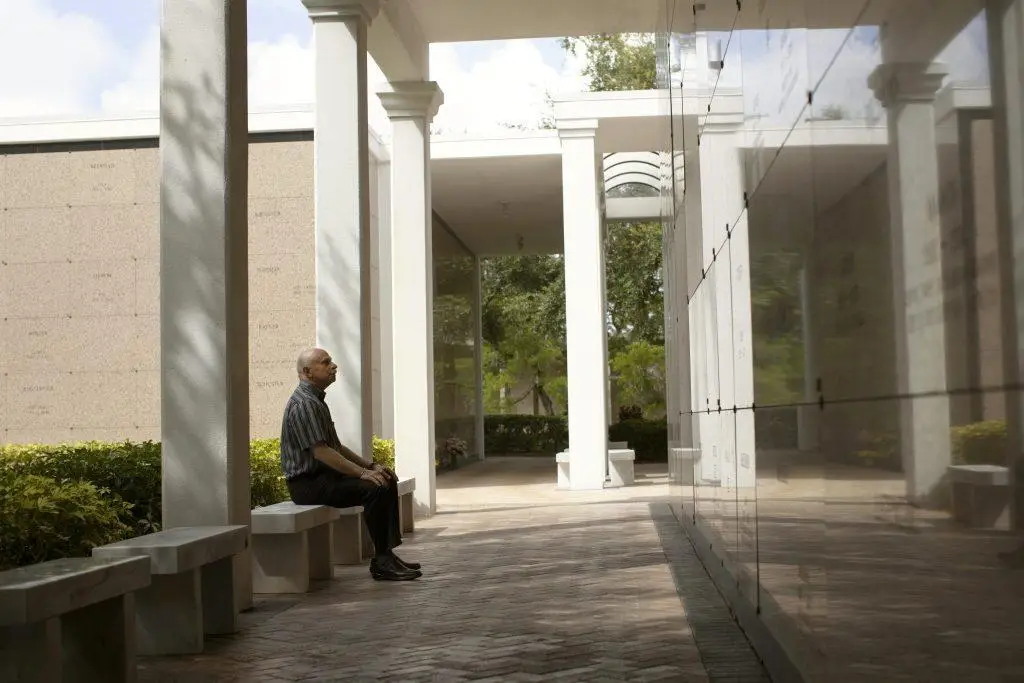 Man Sitting on a Bench in the Breezeways located at the Beth El Mausoleum, located on the Schaefer Family Campus of Temple Beth El in Boca Raton, FL